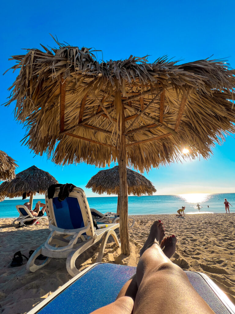 Laying on the beach in Playa Ancon, Trinidad