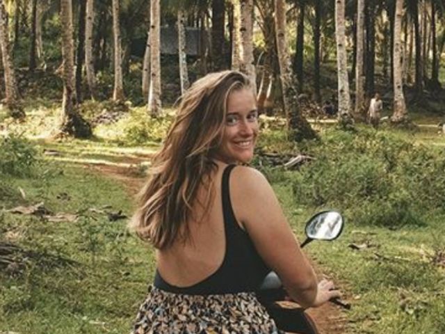 Frances smiling on a scooter